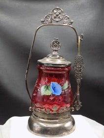 Lovely antique cranberry art glass pickle castor in fancy Meridan frame