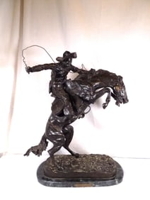 Wonderful signed Remington bronze Bronco Buster recast.