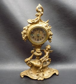 Art Nouveau figural clock with cupid