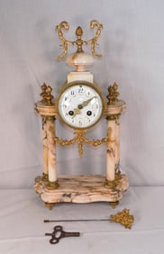 Antique French onyx and brass mantle clock
