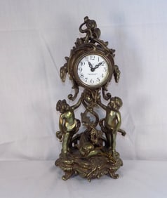 Art Nouveau New Haven figural clock with cupids and dolphins.