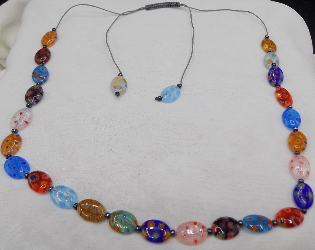 Great millefiori bead art glass necklace: Great millefiori bead art glass necklace. Beautiful colors. In very good original as found condition. Great quality and detail. 21 inches total. And is adjustable. For in house shipping, please call M