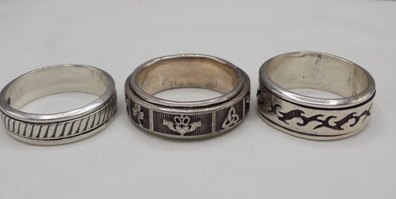 Three sterling silver spinner rings
