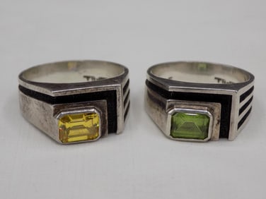 Two vintage artist signed sterling silver citrine and peridot rings