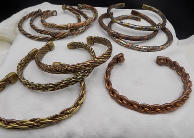 Ten vintage copper, silver and brass bracelets