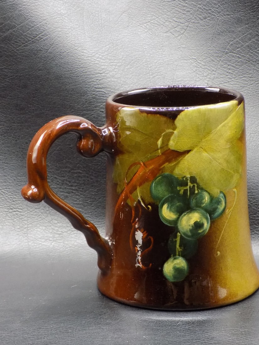 Vintage Roseville Rozane left handed art pottery mug: Vintage Roseville Rozane left handed art pottery mug. Marked on bottom as shown in photos. Beautiful colors. In very good original as found condition. Great quality and detail. White lines are camera 