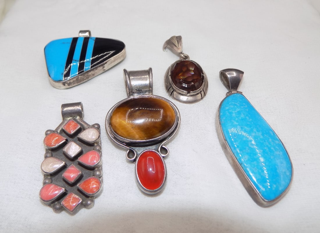 Collection of sterling silver semi-precious stone inlaid pendants: Collection of sterling silver semi-precious stone inlaid pendants. Marked artist signed, and Mexico as shown in photos. Beautiful colors. In very good original as found condition. Great quality and de