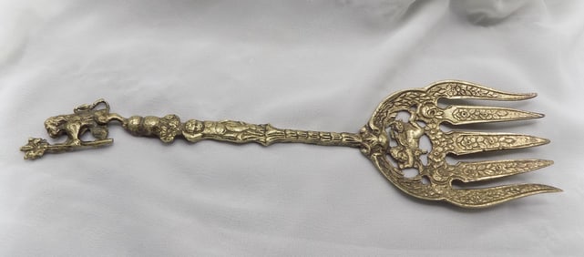 Large fancy vintage silver serving fork with lion and cupid