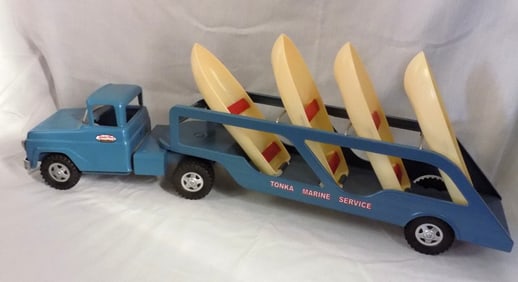 Vintage Tonka Marine Service toy truck and trailer hauling boats
