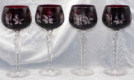 Set of four cut glass deep red to clear wine glasses