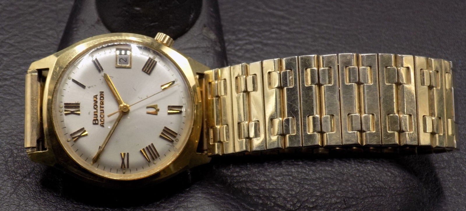 Vintage Bulova Accutron 10k gold fill bezel wristwatch: Vintage Bulova Accutron 10k gold fill bezel wristwatch. 33 mm. Wound tight and is not running at time of listing. For in house shipping, please call Mike at Thriftiques 319-321-0613