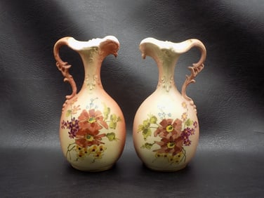 Pair of antique hand painted porcelain ewers