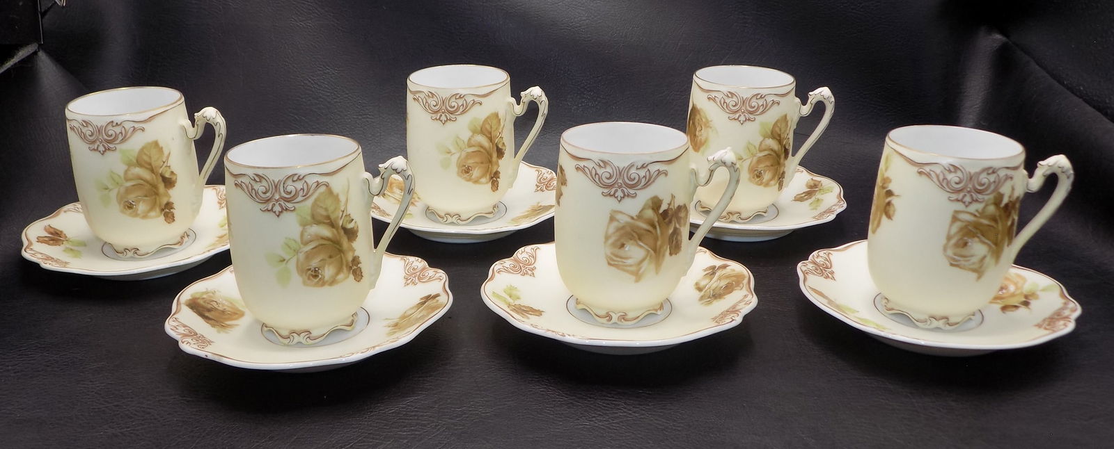 Lovely Old Ivory Silesia hand decorated coffee cups and saucers: Lovely Old Ivory Silesia hand decorated coffee cups and saucers. Marked as shown. Beautiful colors. In very good original as found condition. Cup 3 inches tall saucer 4 ½ across. Great quality