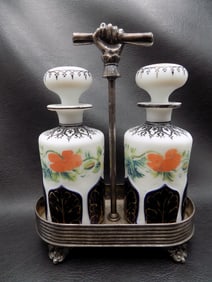 Highly decorated antique cologne or perfume bottles in silverplated holder