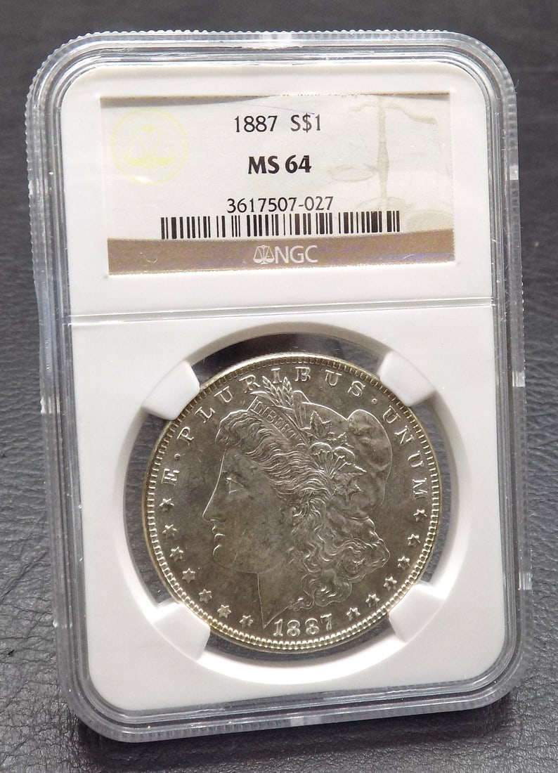 1887 Uncirculated graded by NGC MS64 Morgan silver dollar: 1887 Uncirculated graded by NGC MS64 Morgan silver dollar. For in house shipping. Please call Mike at Thriftiques 319-321-0613