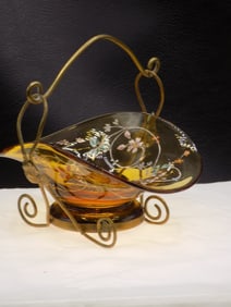 Antique floral decorated art glass basket in holder
