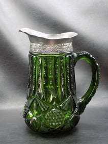 Early American green pattern glass pitcher.