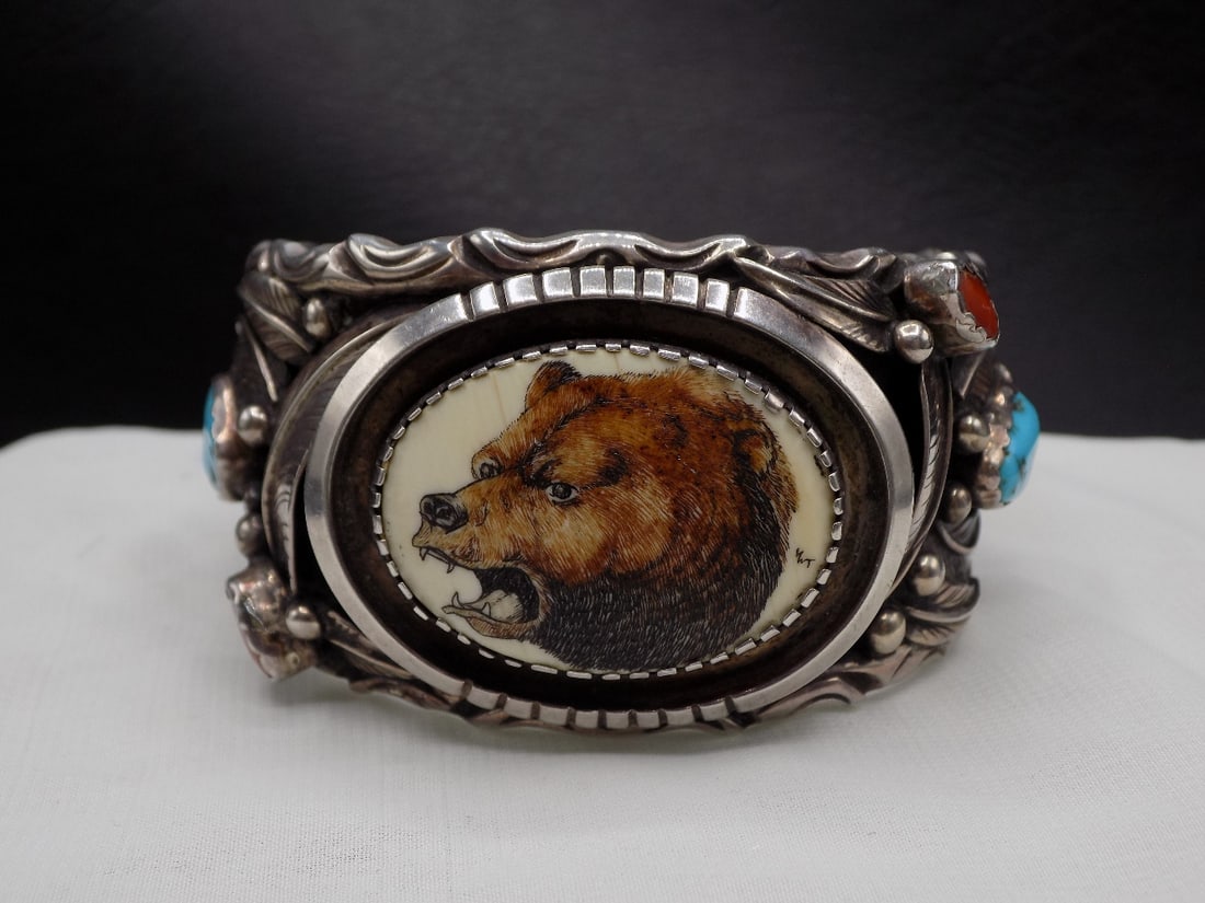Exceptional beautiful vintage Native American Indian turquoise and coral silver bracelet: Exceptional beautiful vintage Native American Indian turquoise and coral silver bracelet. With bear head in center. Artist signed as shown in photo. Probably Peter Nelson. In very good original as fou