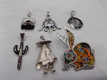 Six charming sterling silver pendants