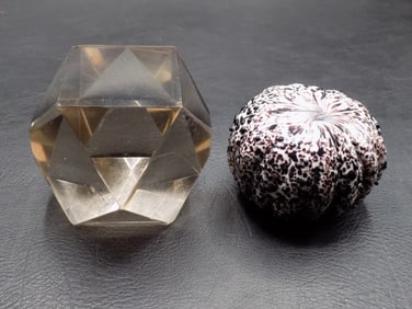 Two vintage glass paperweight.