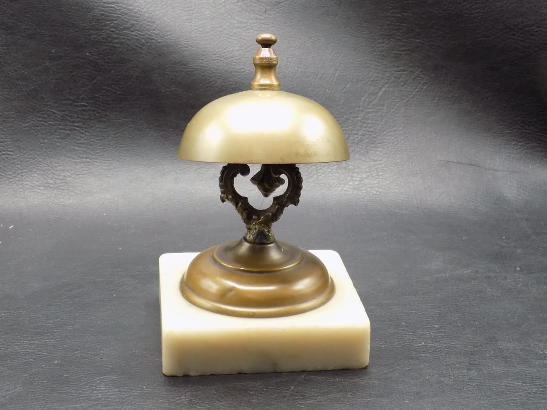 Antique brass hotel front desk bell with marble base: Antique brass hotel front desk bell with marble base. Measures 5 7/8 inches tall. Working and In very good original as found condition. Great quality and detail. For in house shipping, please call Mik