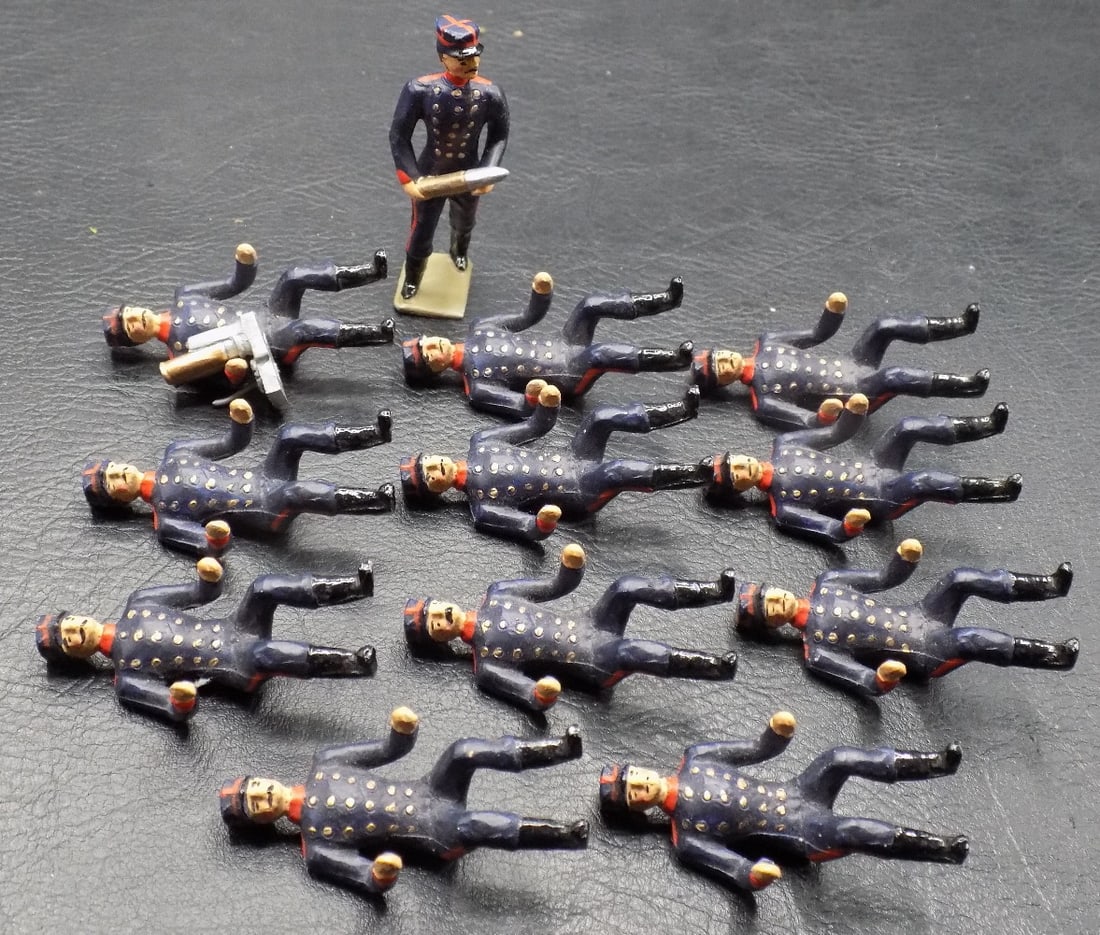 Antique metal toy soldiers by Britains maker.: Antique metal toy soldiers by Britains maker. Measure 1 ¾ inches for sitting soldiers. In very good original as found condition. Great quality and detail. For in house shipping, please call