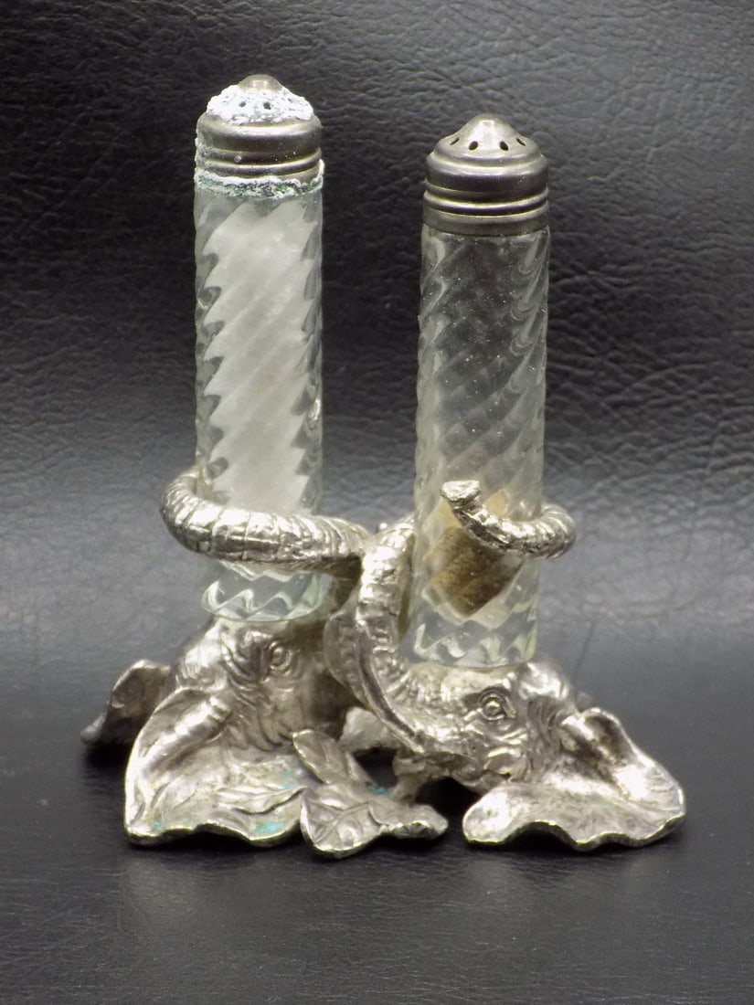 Unusual vintage salt and pepper shakers with elephant base: Unusual vintage salt and pepper shakers with elephant base. Marked on base as shown in photos. In very good original as found condition. Great quality and detail. 4 ¼ inches tall x 3