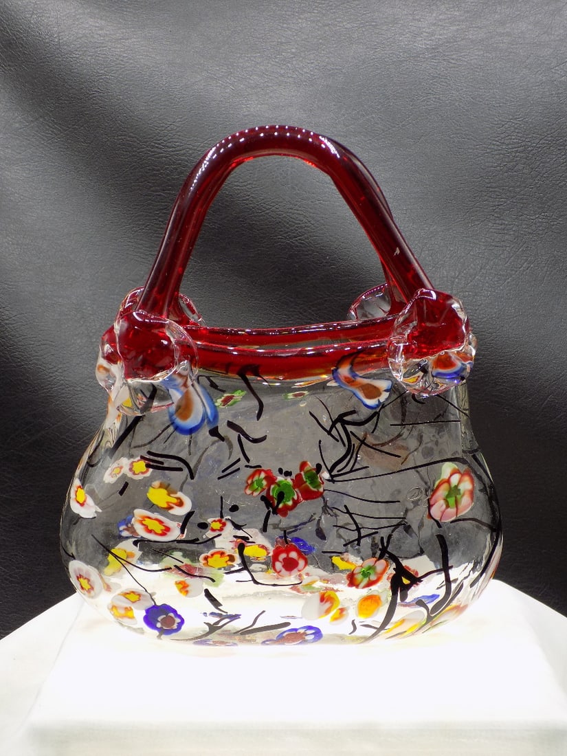 Unique Murano millefiori art glass purse vase: Unique Murano millefiori art glass purse vase. Applied red glass handle. Beautiful colors. In very good original as found condition. Great quality and detail. 8 ¼ inches tall x 7 ½