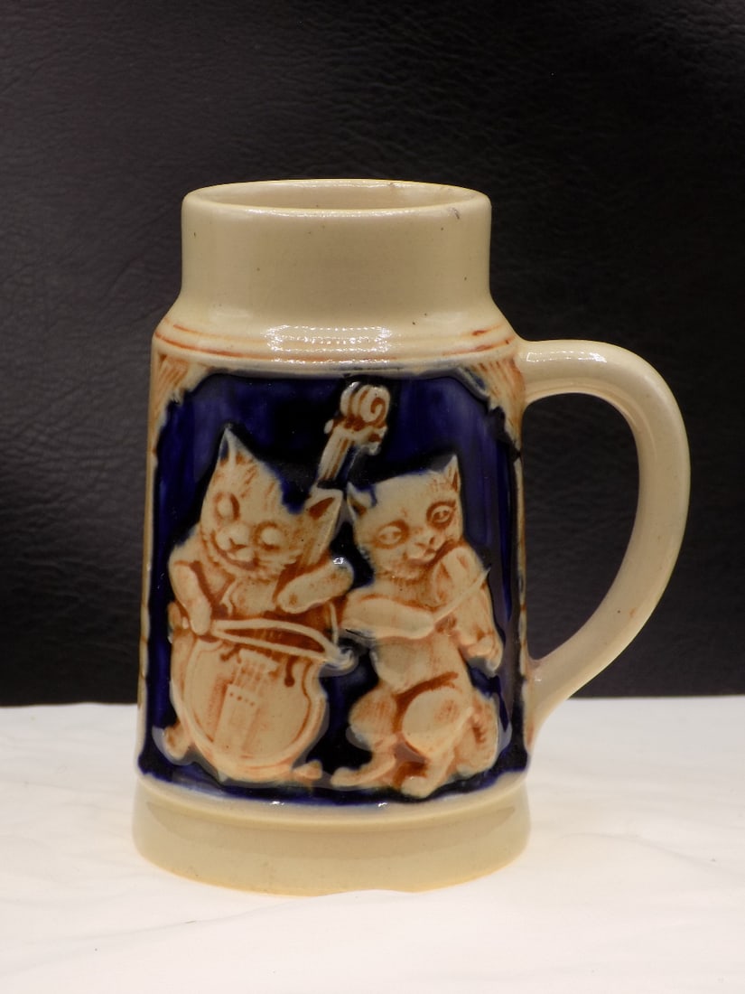 Vintage cat musicians and girl with dog German mug: Vintage cat musicians and girl with dog German mug. Marked on bottom as shown in photo. Beautiful colors. In very good original as found condition. Great quality and detail. 4 inches tall. For in hous
