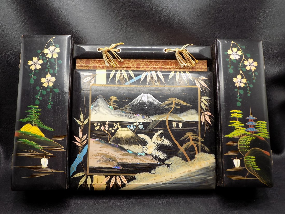 Vintage hand decorated Japanese photo album desk with music box: Vintage hand decorated Japanese photo album desk with music box. Music box works. Sides lift for storage. Beautiful colors. In very good original as found condition with paint loss on base pf one side