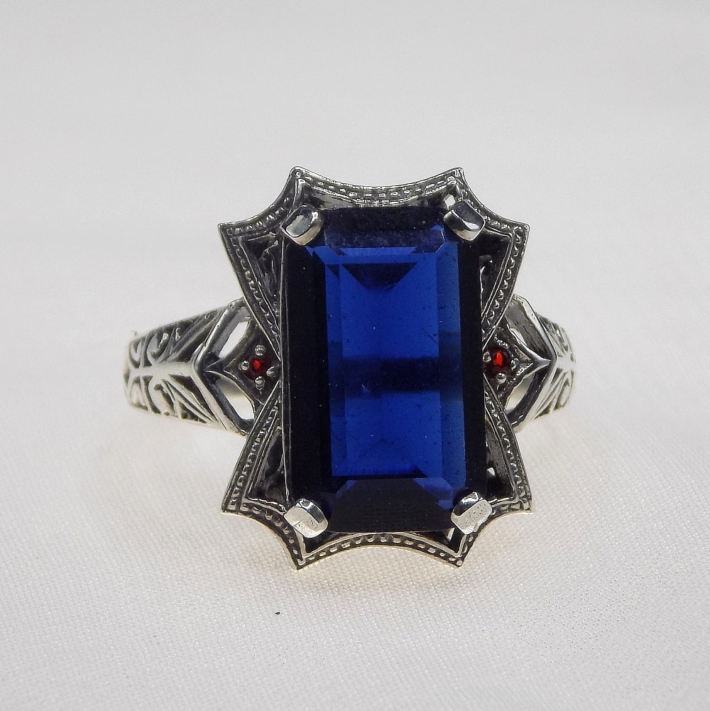 Beautiful 10 ct blue sapphire sterling silver ring: Beautiful 10 ct blue sapphire sterling silver ring. Lab created. Size 8. For in house shipping, please call Mike at Thriftiques 319-321-0613