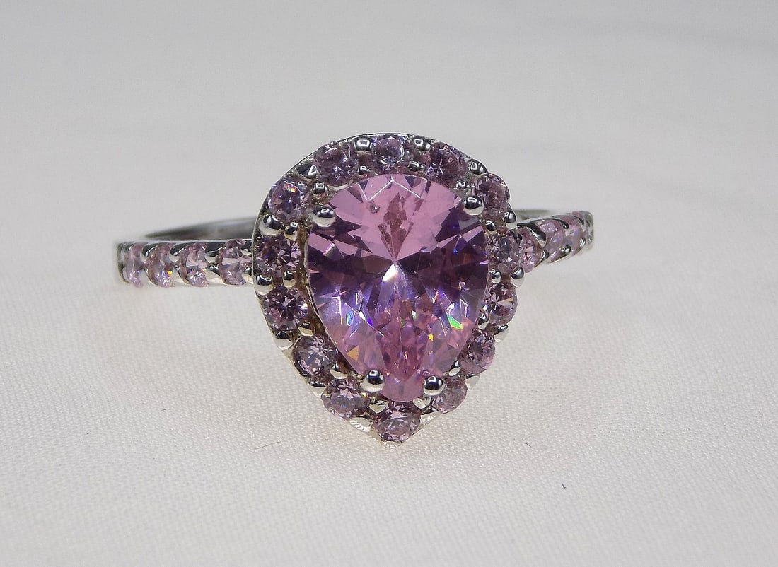 Beautiful 4 cwt pink sapphire sterling silver ring: Beautiful 4 cwt pink sapphire sterling silver ring. Lab created. Size 8. For in house shipping, please call Mike at Thriftiques 319-321-0613