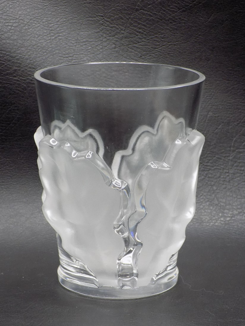 Signed Lalique art glass frosted oak leaf vase: Signed Lalique art glass frosted oak leaf vase. Signed as shown in photo. In very good original as found condition. Great quality and detail. 4 ¾ inches tall. White lines or dots are camera fla