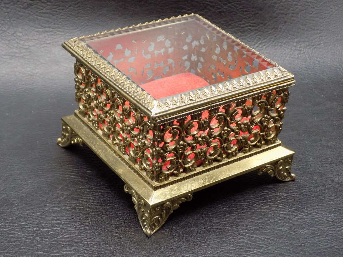 Ornate vintage Art Nouveau jewelry box: Ornate vintage Art Nouveau jewelry box. Beveled glass lid. In very good original as found condition. Great quality and detail. 2 ½ inches tall. 3 ½ square at base. For in house shipping,
