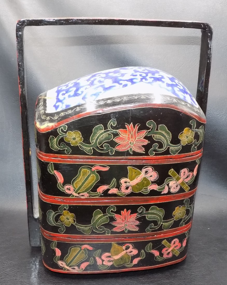 Lovely hand decorated Oriental four tier storage container: Lovely hand decorated Oriental four tier storage container. Hand painted with floral decoration. Porcelain insert in in top. Four containers. Beautiful colors. In very good original as found condition