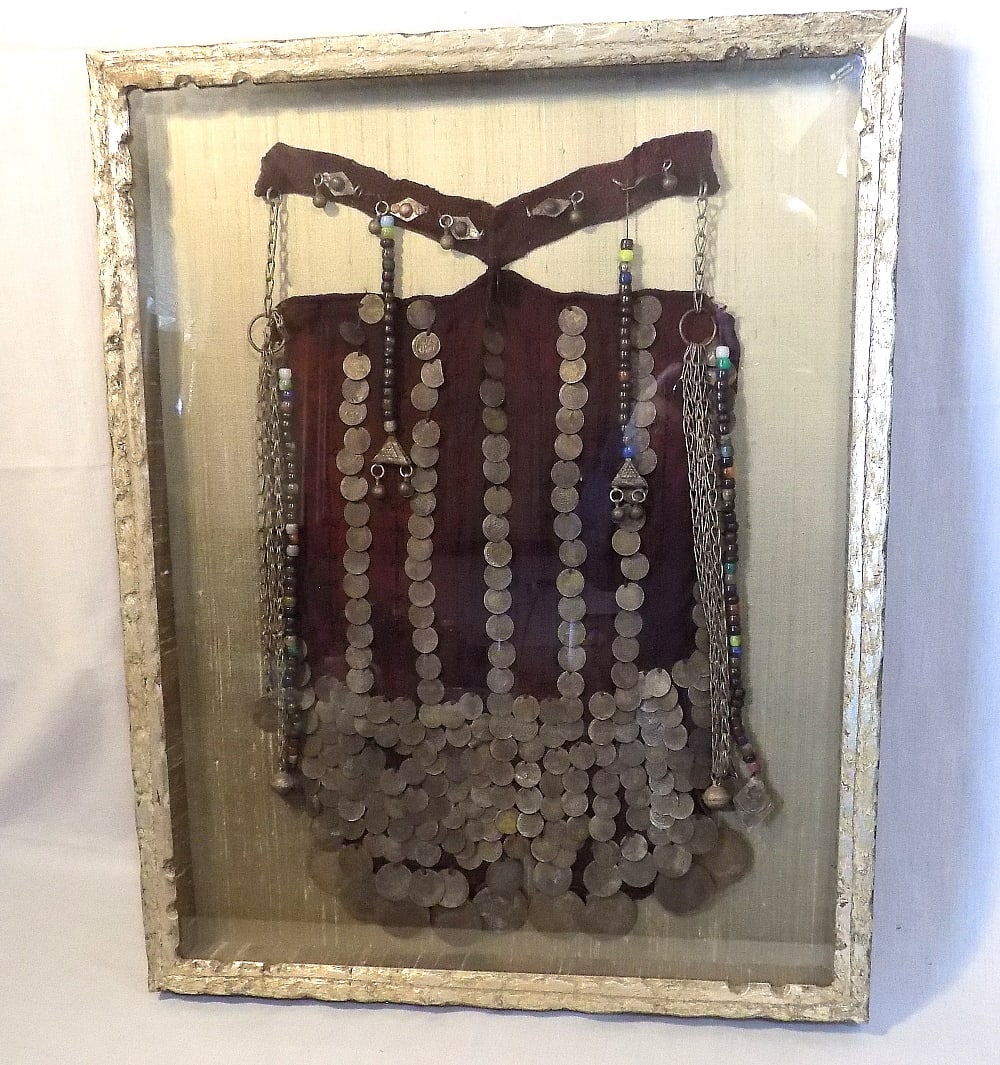 Vintage Bedouin face veil or burqa. Loaded with antique coins: Vintage Bedouin face veil or burqa. Loaded with antique coins. Sealed in cased frame. In very good original as found condition. Great quality and detail. Frame 24 ½ x 19 ½ . Approximatel