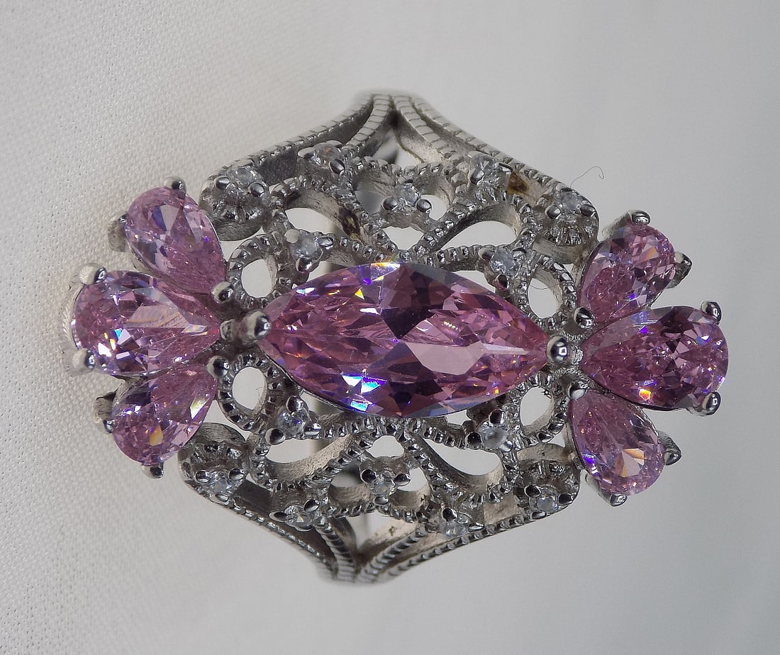 Beautiful 6 ct pink sapphire sterling silver ring: Beautiful 6 ct pink sapphire sterling silver ring. Lab created sapphire. Size 7 ½. For in house shipping, please call Mike at Thriftiques 319-321-0613