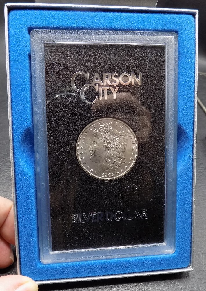 Uncirculated 1883-CC Morgan Dollar, GSA Brilliant White in Holder w/Box & COA: Uncirculated 1883-CC Morgan Dollar, GSA Brilliant White in Holder w/Box & COA. Please see photos. For in house shipping, please call Mike at Thriftiques 319-321-0613