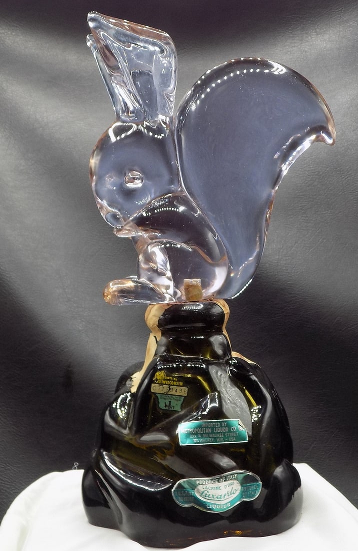 Great midcentury Murano art glass liquor bottle with large squirrel stopper: Great midcentury Murano art glass liquor bottle with large squirrel stopper. Has original labels as shown in photos. Beautiful colors. In very good original as found condition. Great quality and detai