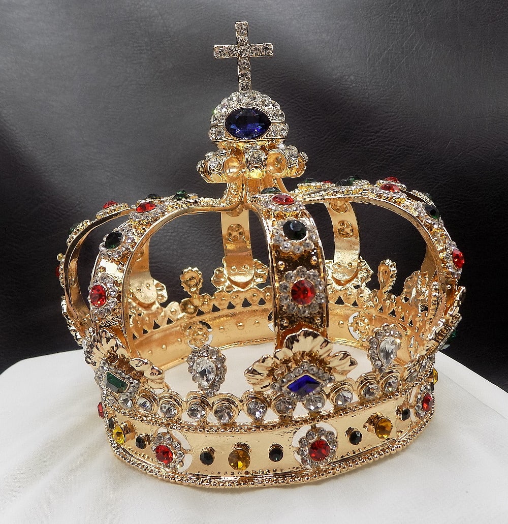 Fancy rhinestone jeweled crown: Fancy rhinestone jeweled crown. Cross on top. Looks to be made within last twenty years. 5 ¾ inches tall. Width at base 4 ¾ inches. Beautiful colors. In very good original as found