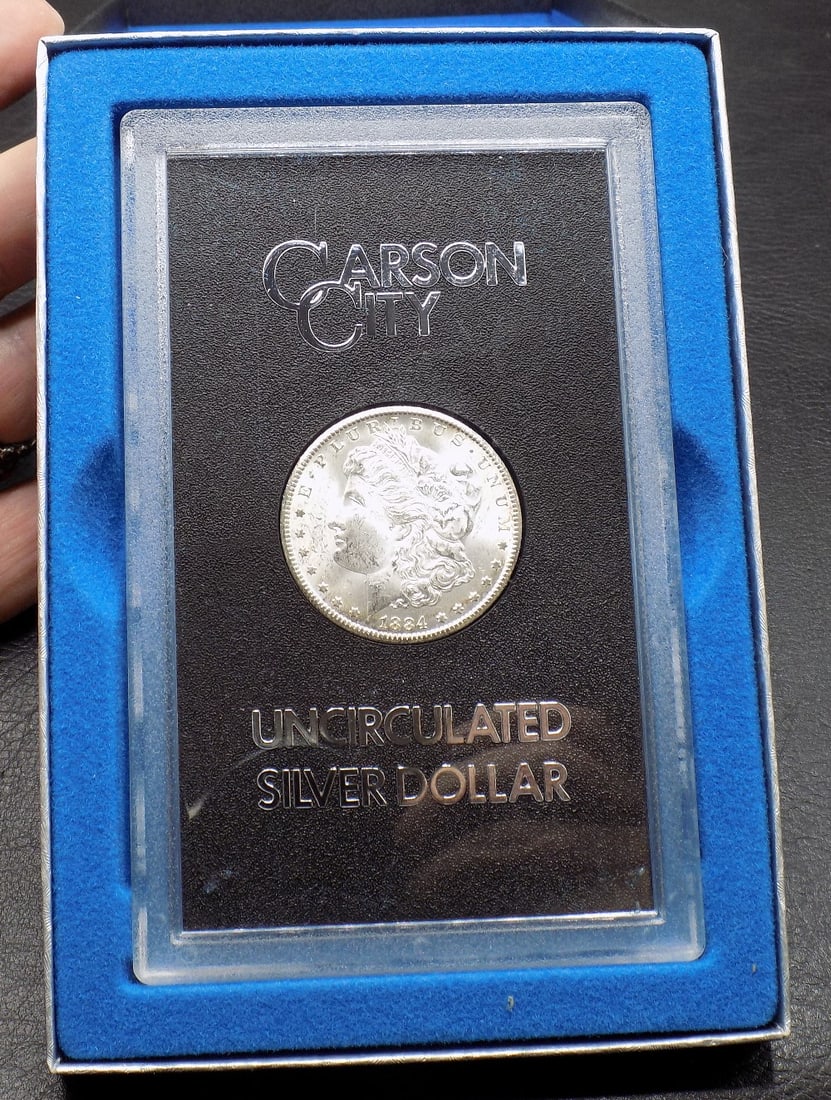 Uncirculated 1884-CC Morgan Dollar, GSA Brilliant White in Holder w/Box & COA: Uncirculated 1884-CC Morgan Dollar, GSA Brilliant White in Holder w/Box & COA. Please see photos. For in house shipping, please call Mike at Thriftiques 319-321-0613