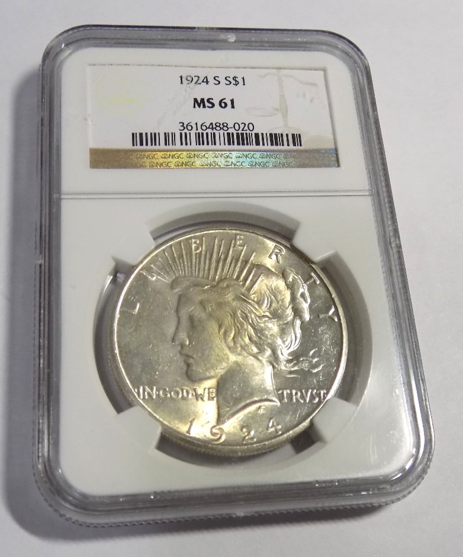 1924 S Uncirculated graded by NGC MS61 silver dollar: 1924 S Uncirculated graded by NGC MS61 silver dollar. Please see photos. For in house shipping. Please call Mike at Thriftiques 319-321-0613