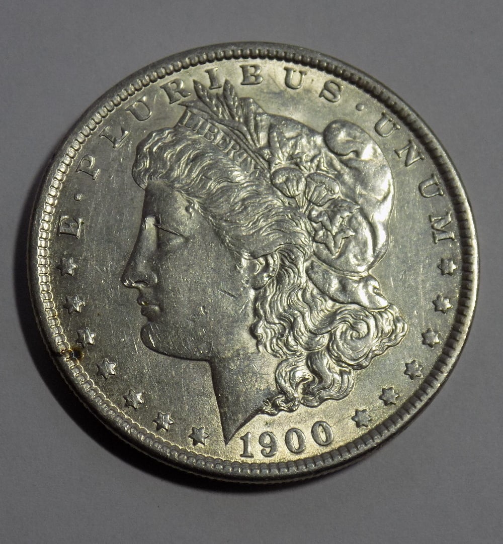 Uncirculated 1900 Morgan silver dollar: Uncirculated 1900 Morgan silver dollar. Please see photo for condition. For in house shipping. Please call Mike at Thriftiques 319-321-0613