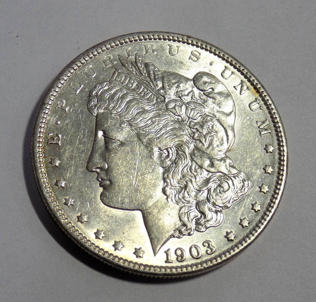 Uncirculated 1903 Morgan silver dollar: Uncirculated 1903 Morgan silver dollar. Please see photos. For in house shipping. Please call Mike at Thriftiques 319-321-0613