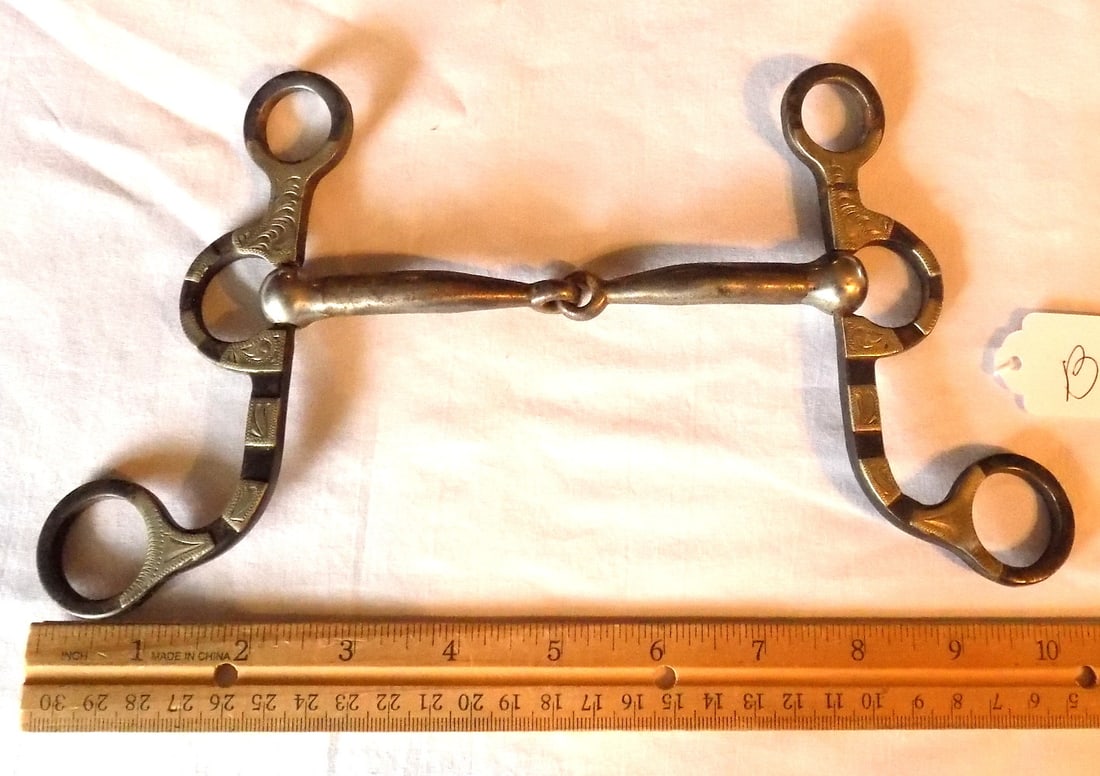 Fancy signed antique horse bit.: Fancy signed antique horse bit. Nicely overlaid and engraved sterling silver. Maker marked with turtle. Please see photos with ruler for size. In very good original as found condition. Great quality a