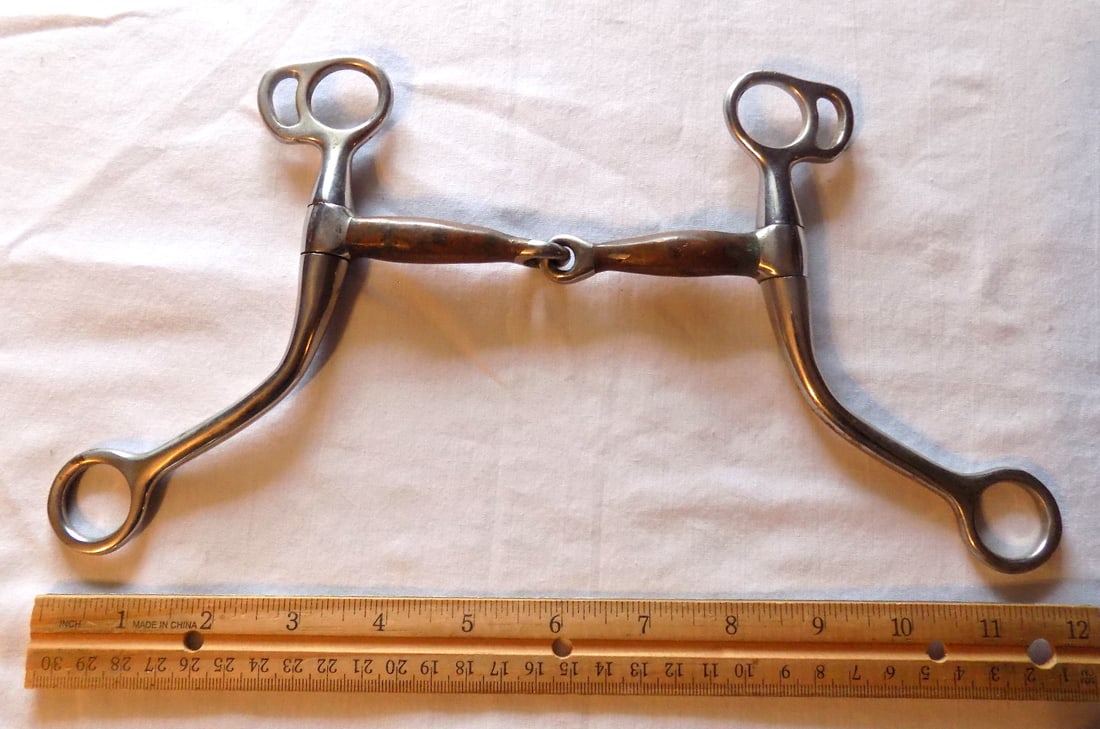Antique Val A signed horse bit: Antique Val A signed horse bit. Please see photos with ruler for size. In very good original as found condition. Great quality and detail. For in house shipping, please call Mike at Thriftiques 319-32