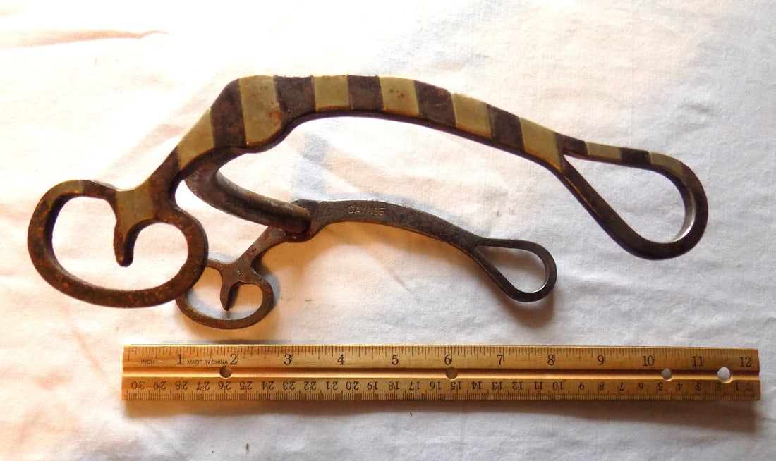 Antique Cayuse signed silver overly horse bit: Antique Cayuse signed silver overly horse bit. Please see photos with ruler for size. In very good original as found condition. Great quality and detail. For in house shipping, please call Mike at Thr