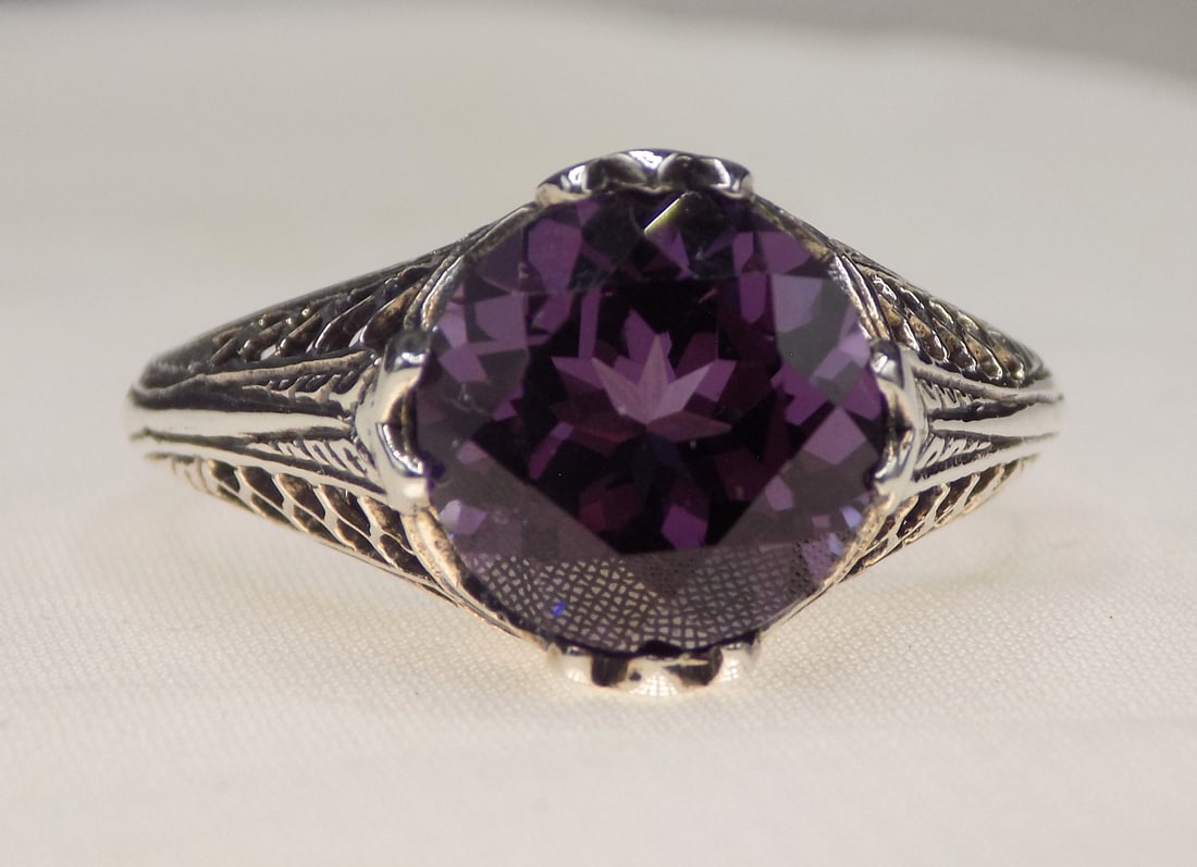 Beautiful 4 ct alexandrite sterling silver ring: Beautiful 4 ct alexandrite sterling silver ring. Lab created. Size 9. For in house shipping, please call Mike at Thriftiques 319-321-0613