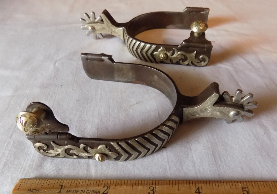 Fancy antique decorated sterling overly spurs: Fancy antique decorated sterling overly spurs. Please see photos with ruler for size. In very good original as found condition. Great quality and detail. For in house shipping, please call Mike at Thr