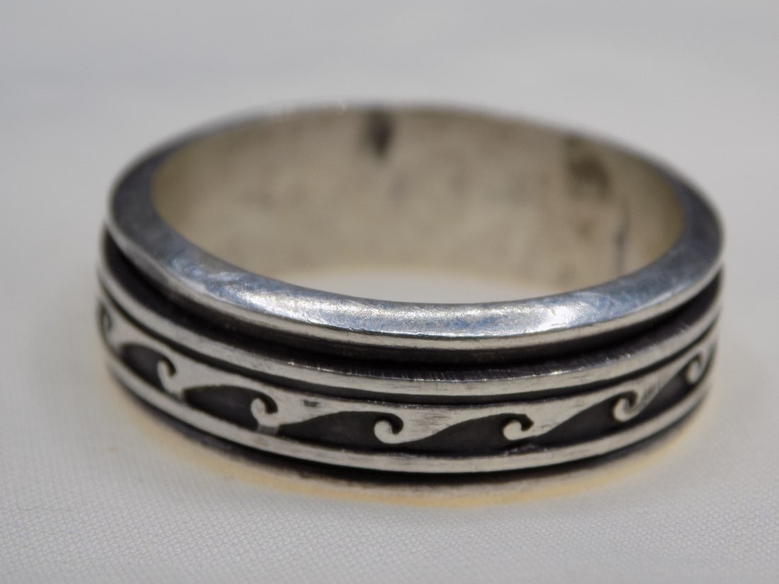 Vintage rotating silver ring size 12: Vintage rotating silver ring size 12. For in house shipping. Please call Mike at Thriftiques 319-321-0613